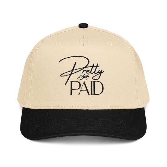 A trendy women’s trucker cap for everyday wear, the Pretty & Paid Hat is a stylish 5 panel snapback hat for women designed for casual outfits, streetwear style, and content creation.